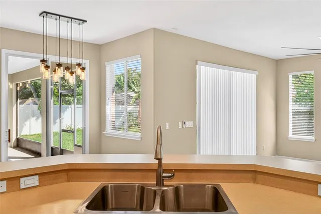 a living room with furniture a rug and a window