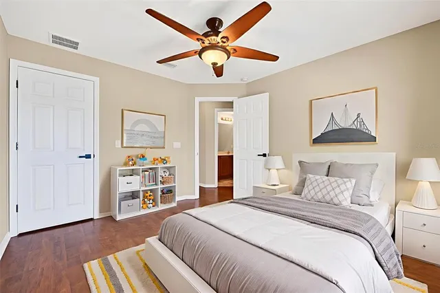 a view of a workspace with furniture and wooden floor