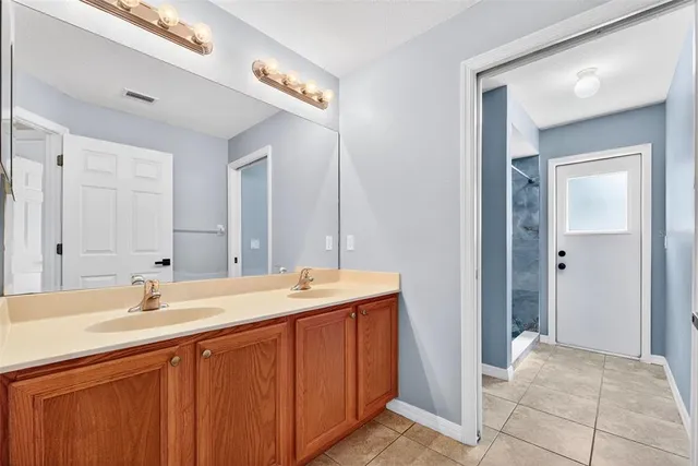a view of an outdoor dining space with a table and chairs
