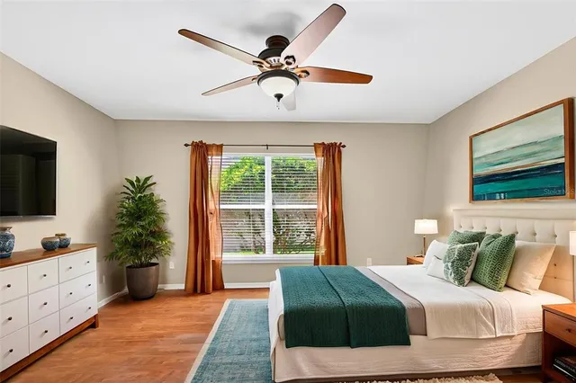 a view of a house with a yard and potted plants
