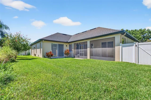 a view of a swimming pool with a yard
