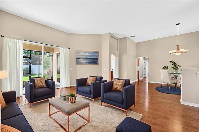 a view of a dining room with furniture window and wooden floor