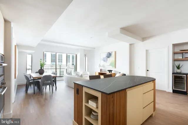 a bedroom with a large bed and a potted plant