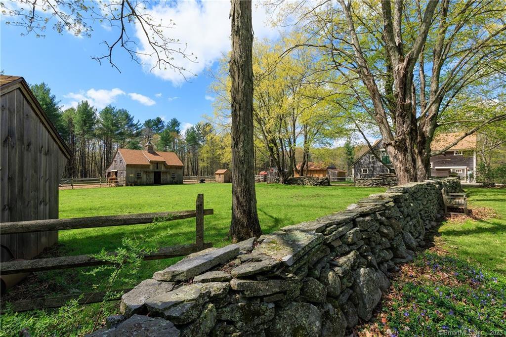 The stonewall lined driveway up to the compound at 341 River Road, Putnam. The Run-in on the left, the 2-stall Horse Barn, the new Shed, and the huge Barn!