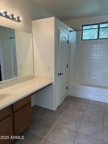 a bathroom with a shower and a sink