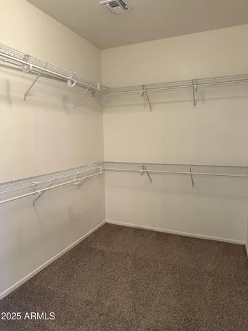 a view of an empty walk in closet