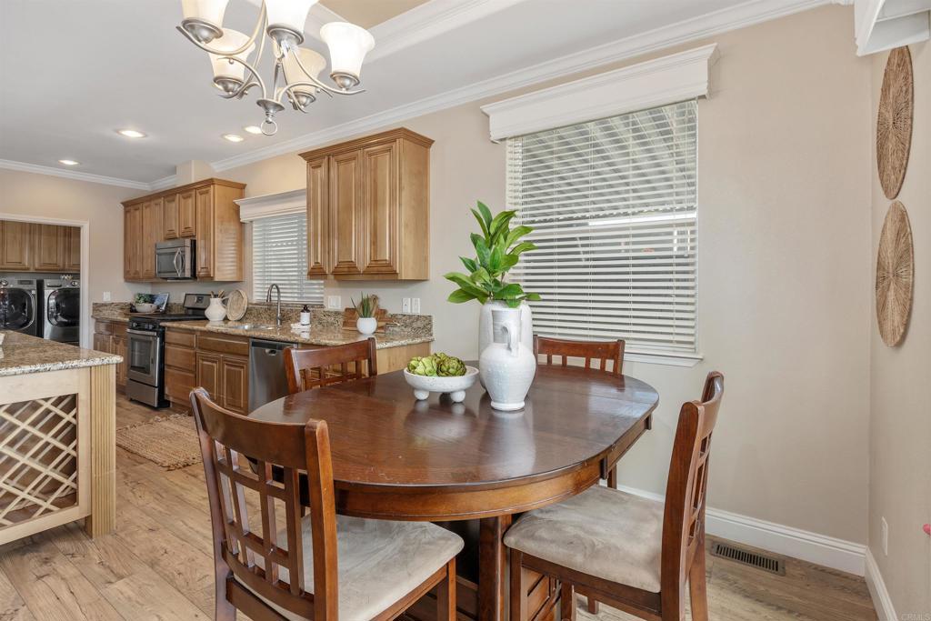 9500 Harritt Road, Unit 29 Lakeside, CA 92040 - Photo 13 of 32 a dining room with furniture and chandelier