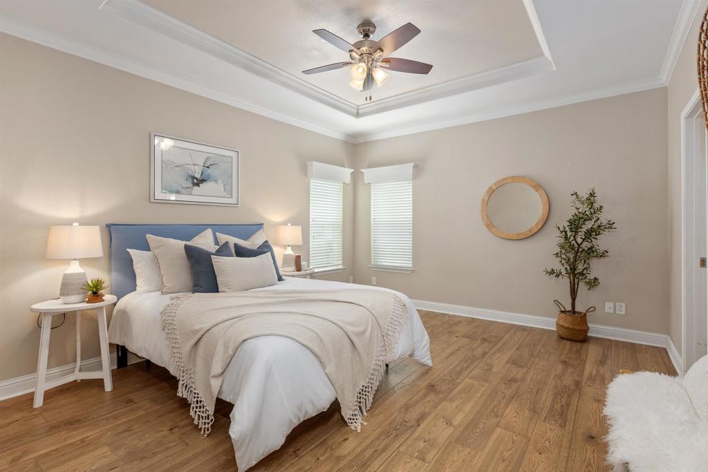 9500 Harritt Road, Unit 29 Lakeside, CA 92040 - Photo 19 of 32 a spacious bedroom with a bed and a chandelier