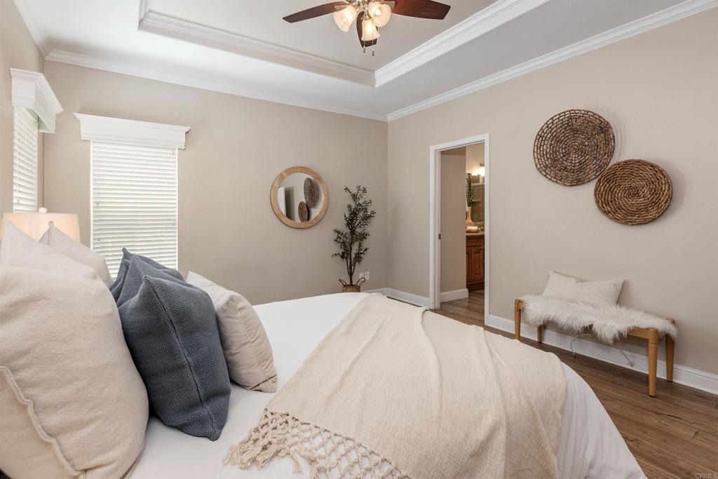 9500 Harritt Road, Unit 29 Lakeside, CA 92040 - Photo 20 of 32 a bedroom with a bed and a chandelier