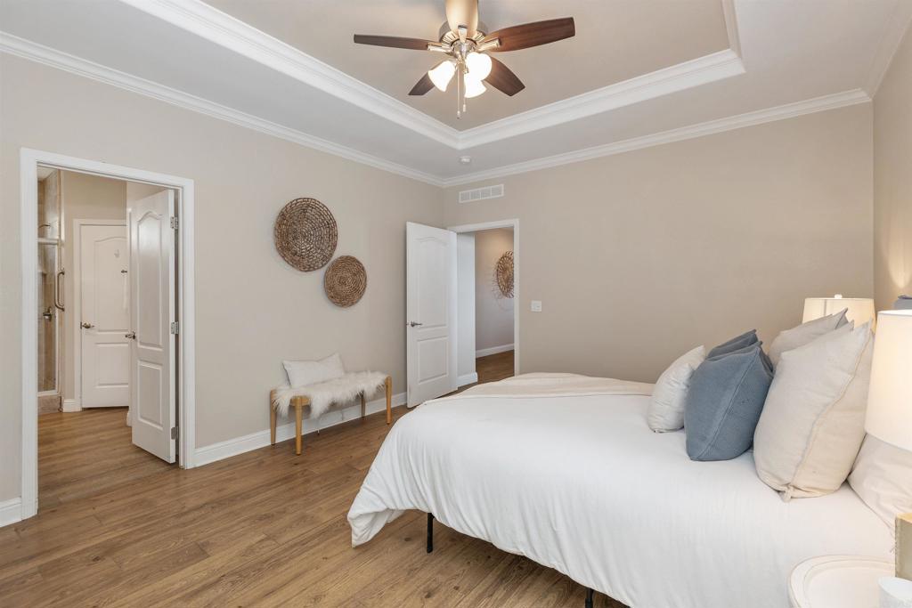 9500 Harritt Road, Unit 29 Lakeside, CA 92040 - Photo 21 of 32 a bedroom with a bed and a chandelier