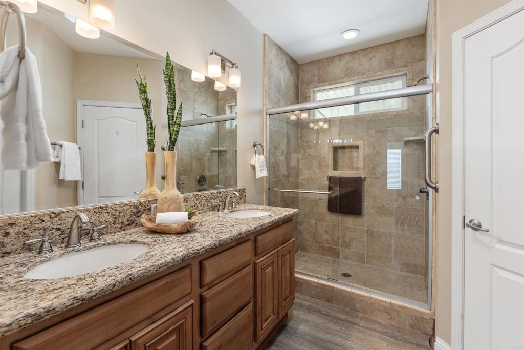 9500 Harritt Road, Unit 29 Lakeside, CA 92040 - Photo 23 of 32 a bathroom with a granite countertop sink mirror and shower