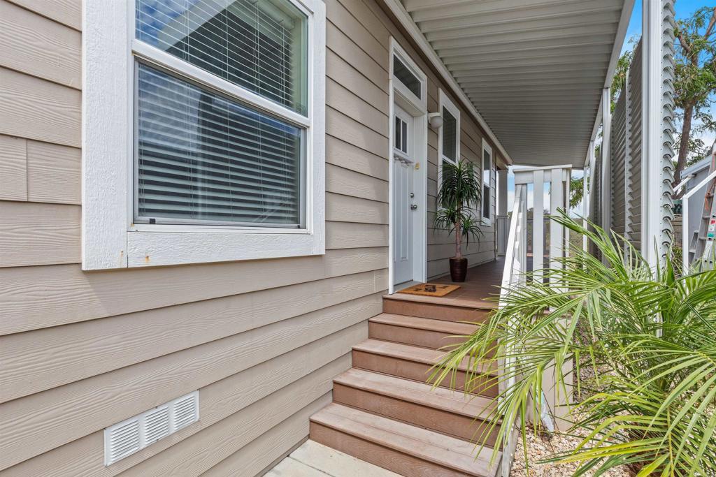 9500 Harritt Road, Unit 29 Lakeside, CA 92040 - Photo 3 of 32 a view of house with wooden stairs and floor to ceiling window and stairs