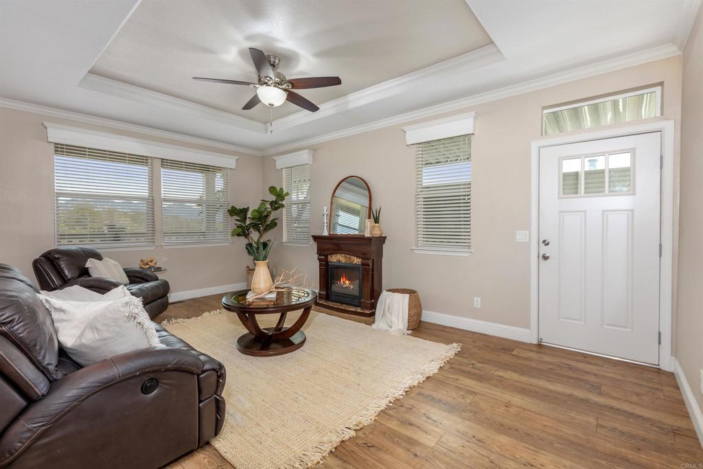 9500 Harritt Road, Unit 29 Lakeside, CA 92040 - Photo 8 of 32 a living room with furniture a chandelier and a window