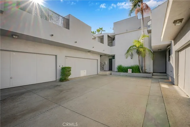 a view of a street with a garage