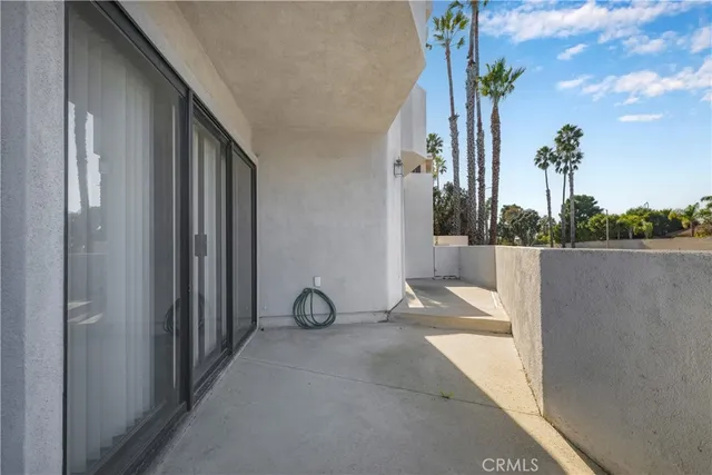 a view of a path along with potted plants