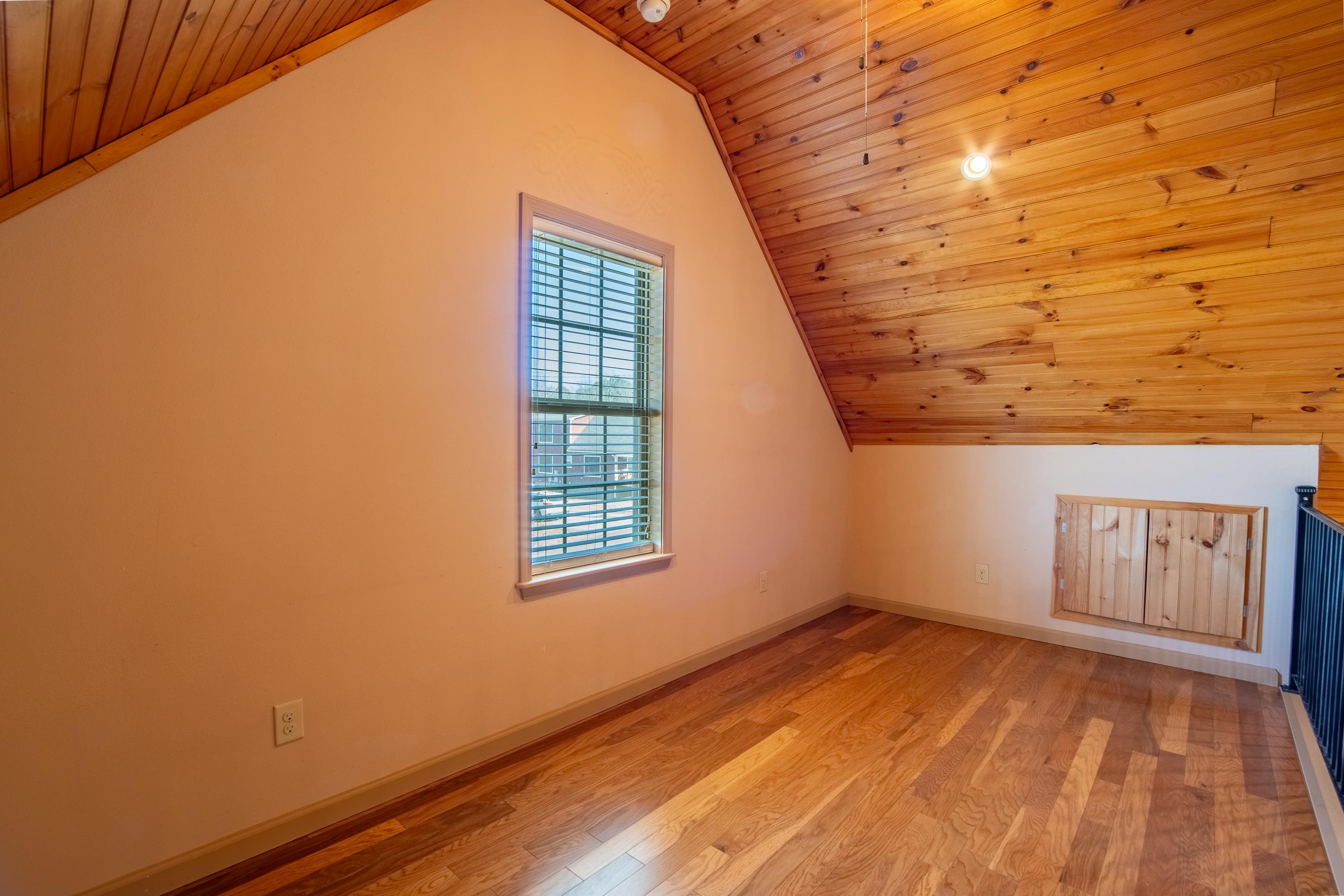 20 Bogey Loop Counce, TN 38326 - Photo 11 of 39 Additional living space featuring wood ceiling, lofted ceiling, and light hardwood / wood-style floors
