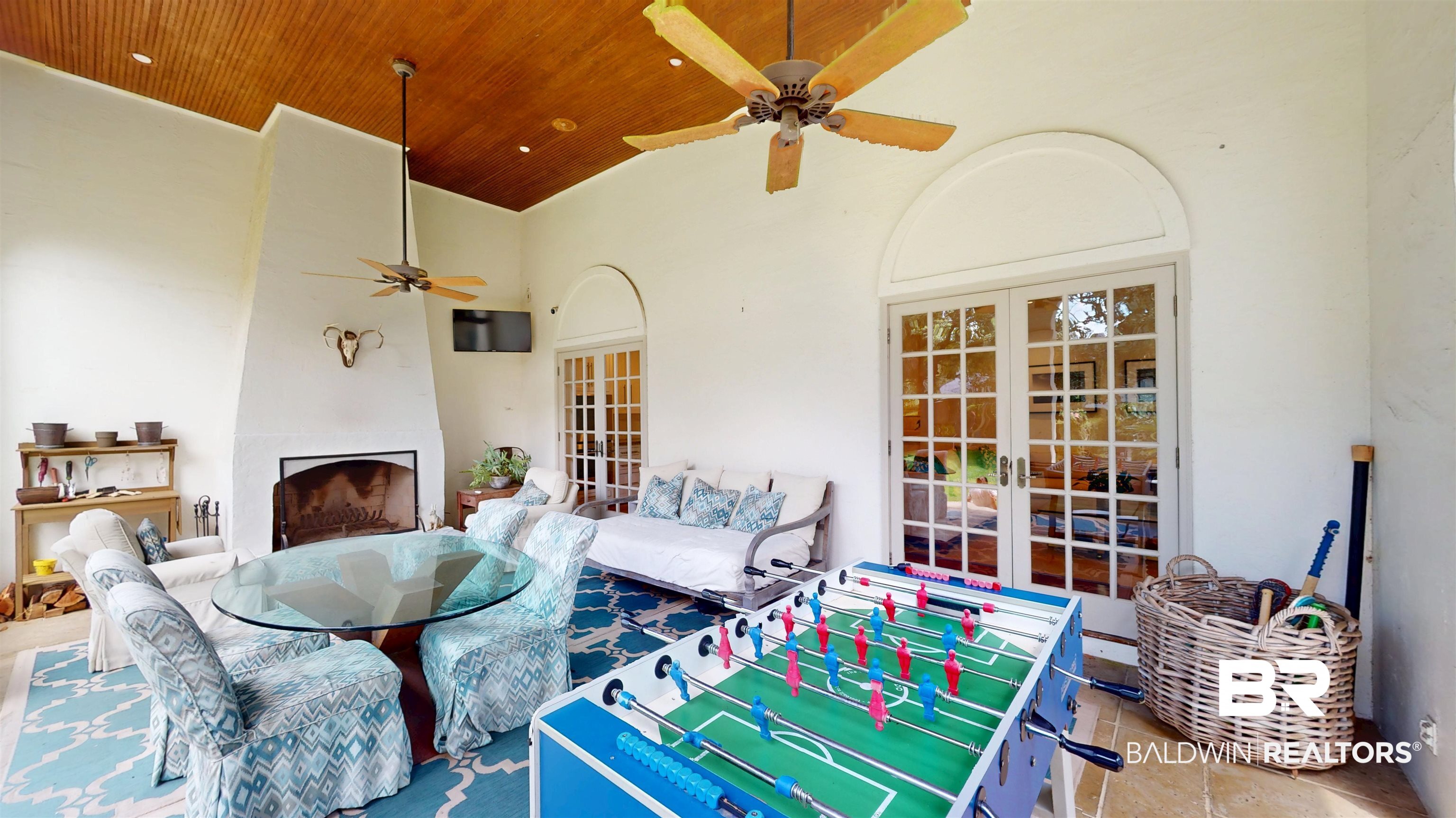 211 Lanier Avenue Mobile, AL 36607 - Photo 59 of 73 View of patio featuring french doors, a fireplace, ceiling fan, and outdoor dining space