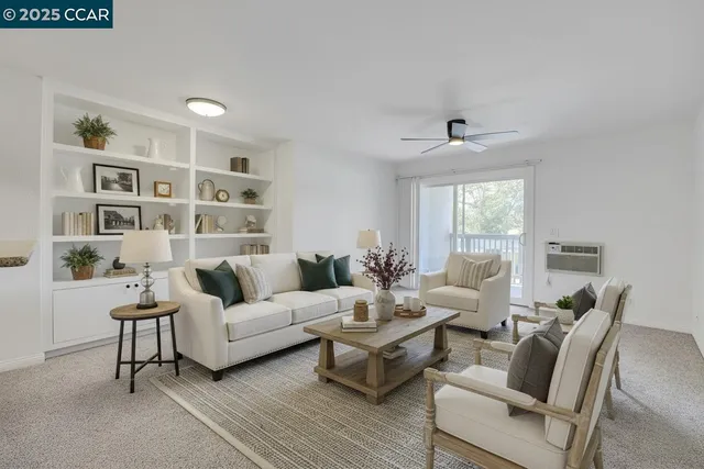 a living room with furniture and a window