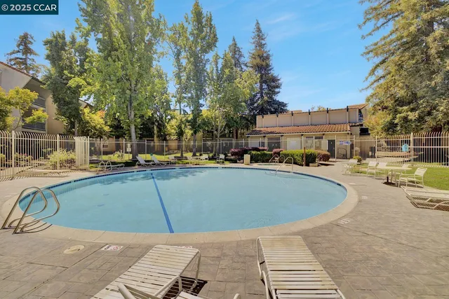 a balcony with furniture and garden view