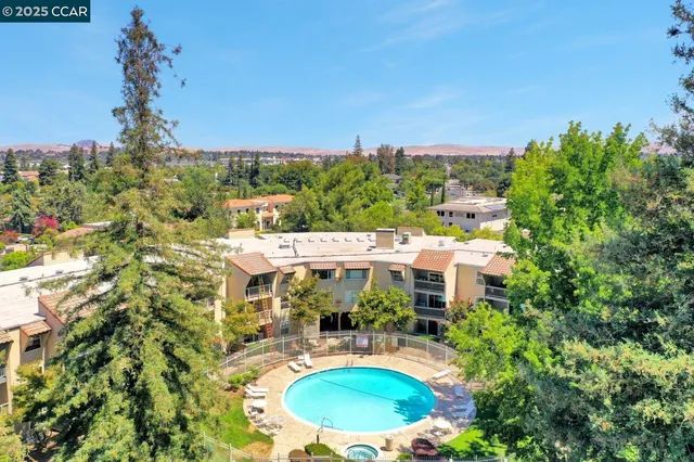 a front view of a building with a garden