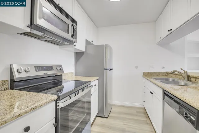 a kitchen with a stove and a sink