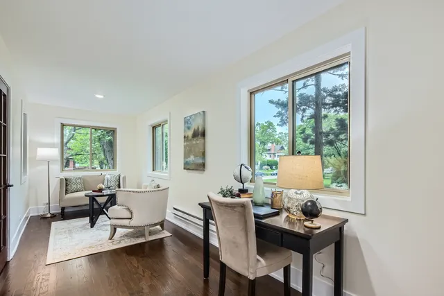 a living room with furniture a window and a table