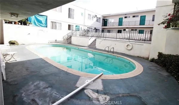 a view of a living room and kitchen