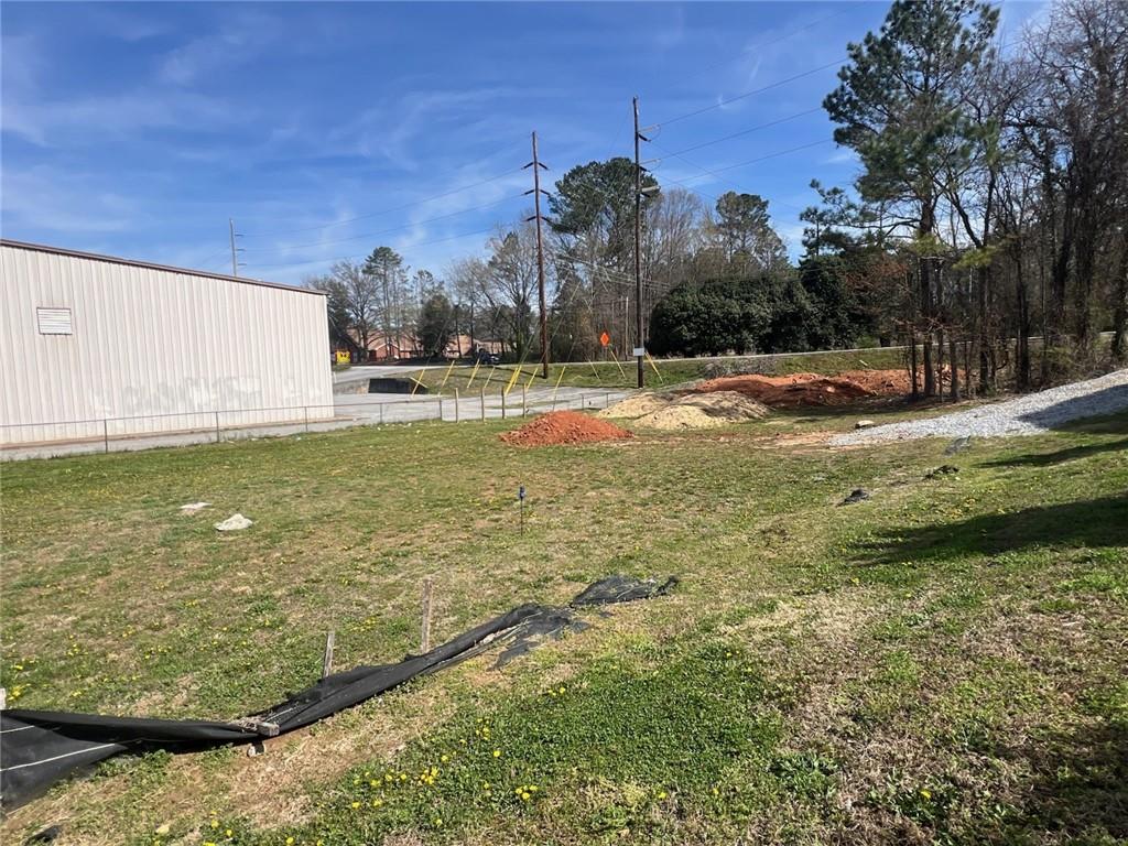 265 Arcado Road Northwest Lilburn, GA 30047 - Photo 2 of 5 a view of a fountain is middle in the yard