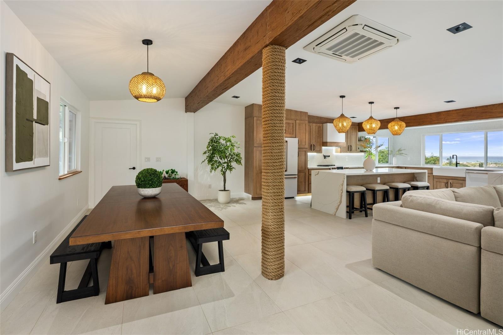 852 Kainoa Place Honolulu, HI 96821 - Photo 7 of 25 a living room with furniture kitchen view and a chandelier