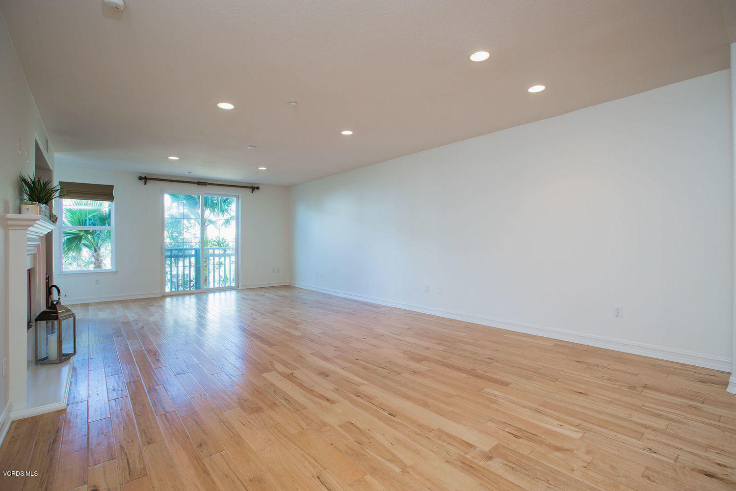1533 Windshore Way Oxnard, CA 93035 - Photo 13 of 28 a view of an empty room with wooden floor and a window