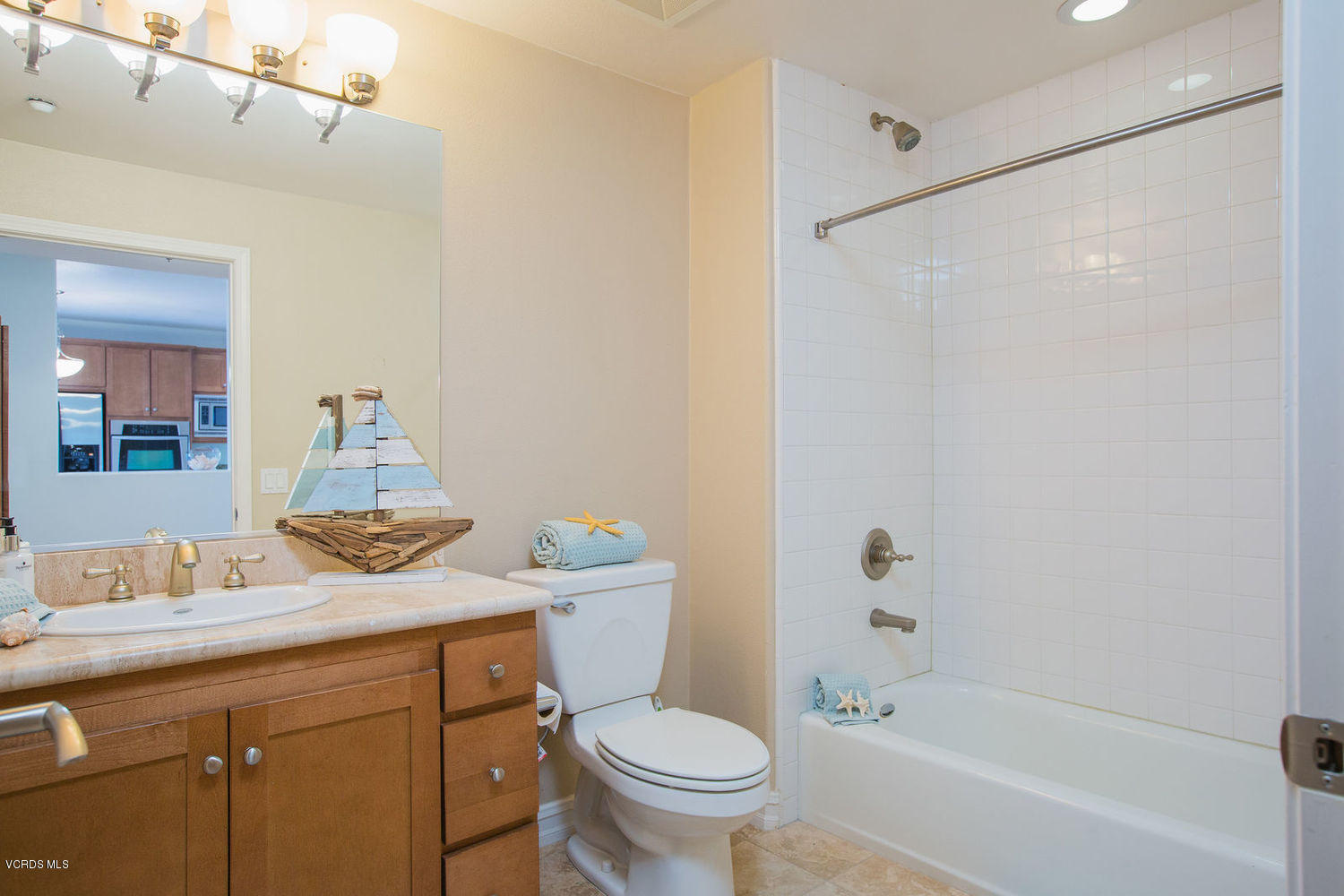 1533 Windshore Way Oxnard, CA 93035 - Photo 20 of 28 a bathroom with a granite countertop sink toilet and shower