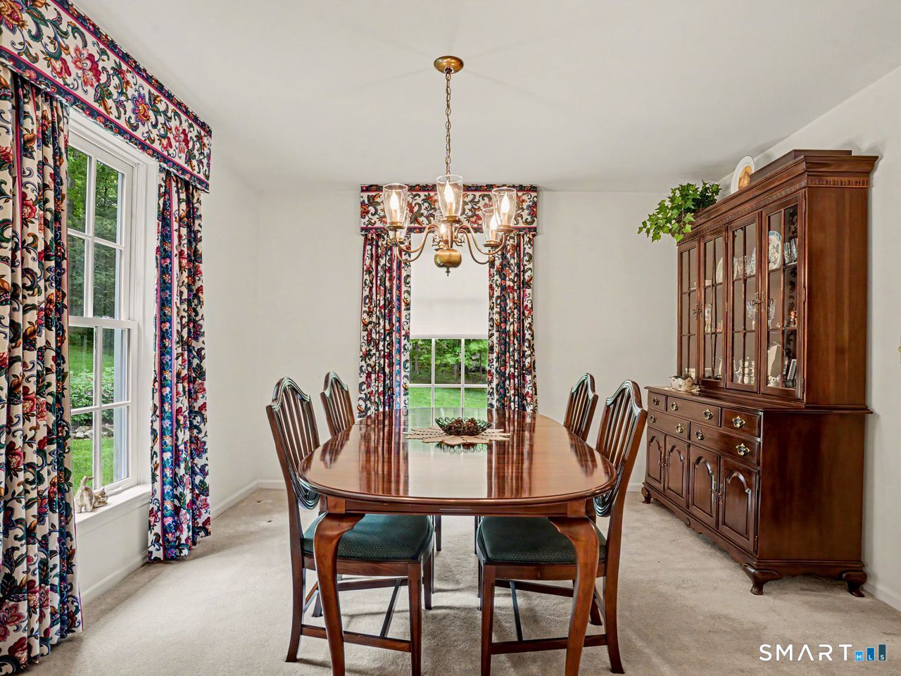 86 Fire Hill Road Redding, CT 06896 - Photo 12 of 36 a view of a dining room with furniture window and outside view