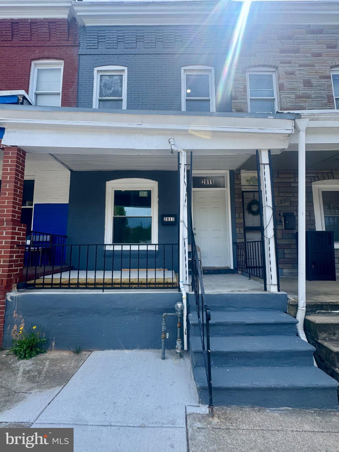 Charming urban home with inviting porch.