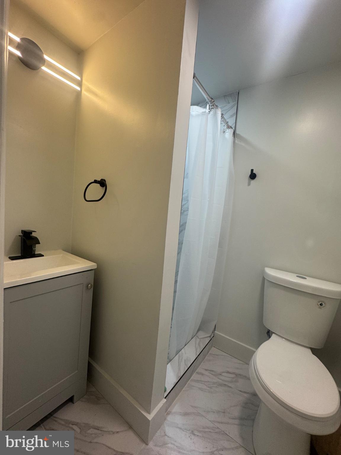 2811 East Preston Street Baltimore, MD 21213 - Photo 14 of 14 Sleek and modern bathroom retreat.