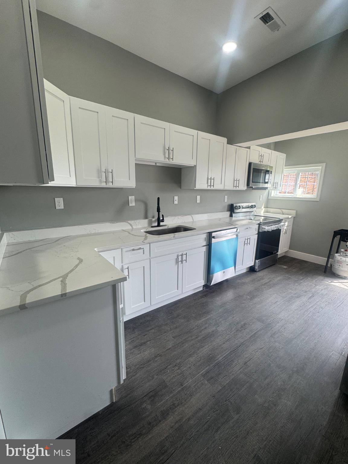 2811 East Preston Street Baltimore, MD 21213 - Photo 3 of 14 Modern kitchen with sleek finishes.