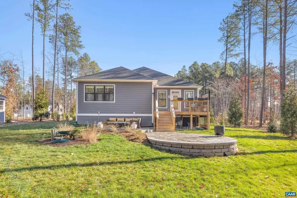 a front view of a house with a yard table and chairs