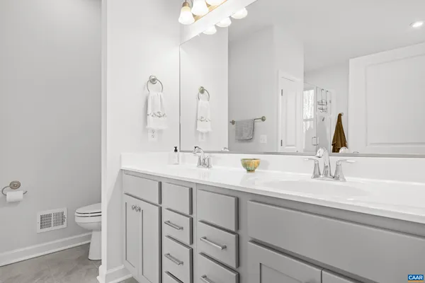 a white bath tub sitting next to a white sink
