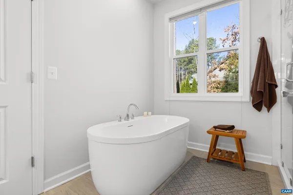 a bedroom with a bed and a lamp