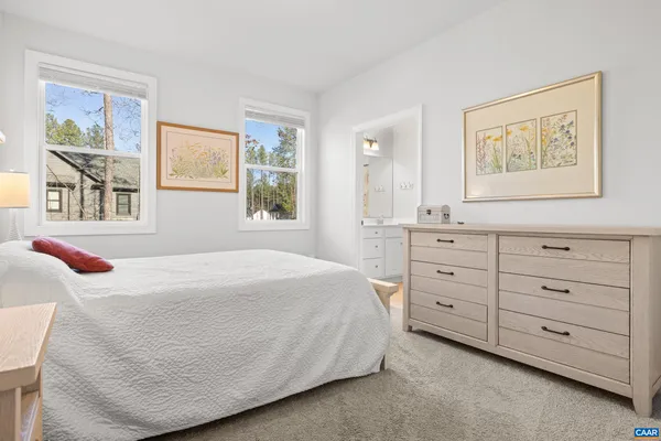 a bathroom with a sink a mirror and shower curtain