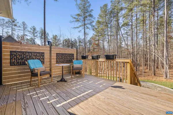 a swimming pool with outdoor seating and yard