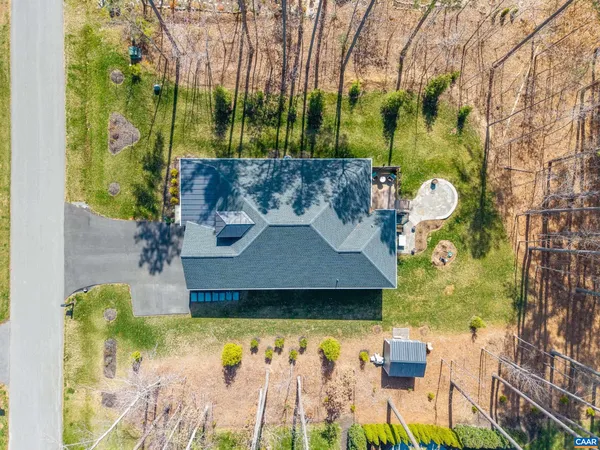 a view of a house with a yard and a swimming pool