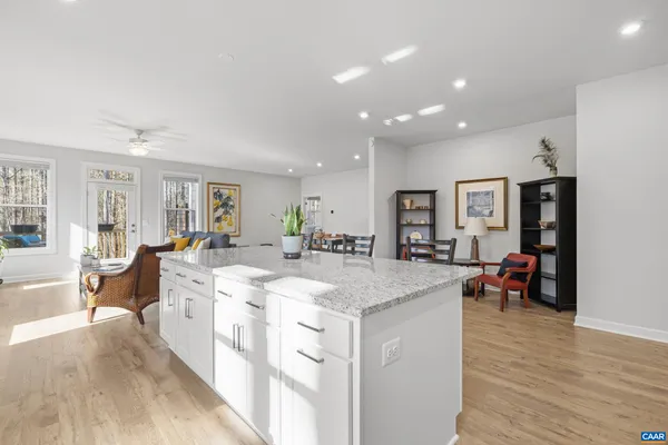 a kitchen with sink a stove and cabinets