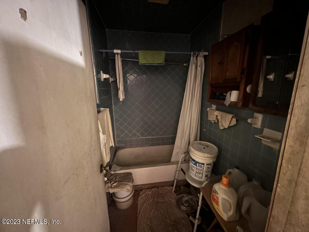1760 Lilly Road East Jacksonville, FL 32207 - Photo 17 of 18 a bathroom with a sink and toilet