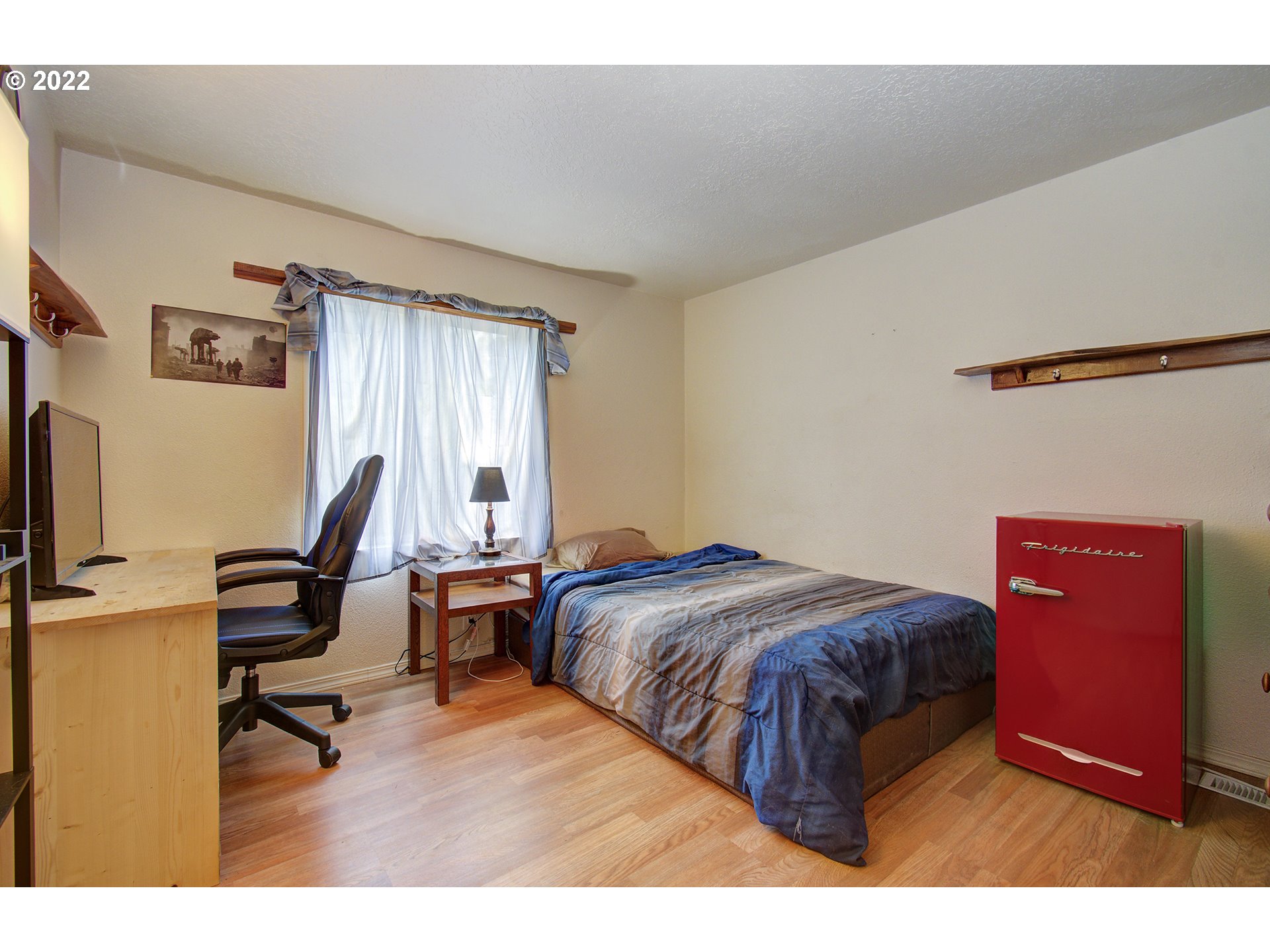 24416 Northeast Berry Road Battle Ground, WA 98604 - Photo 13 of 31 a bedroom with a bed a desk and chair
