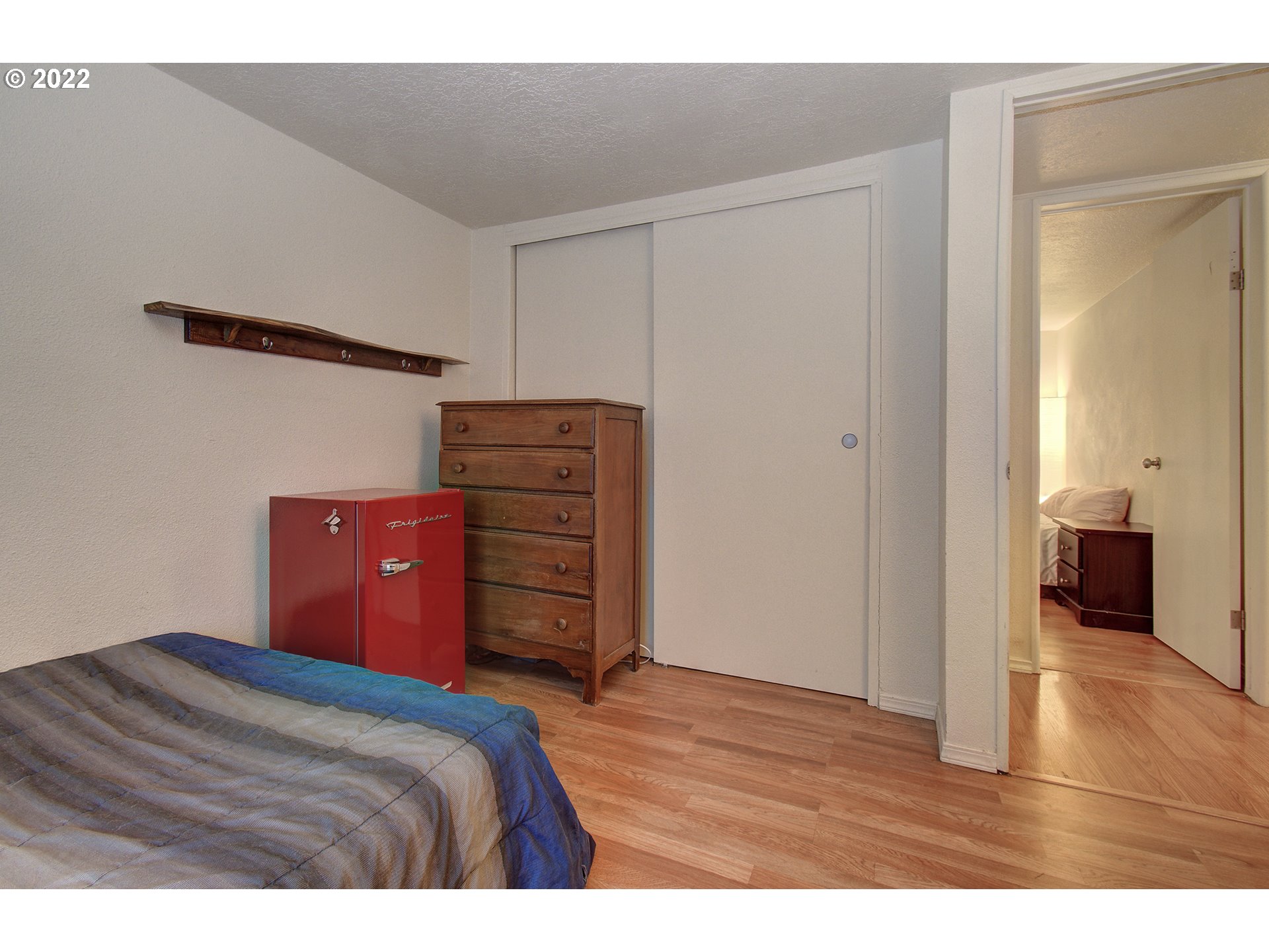 24416 Northeast Berry Road Battle Ground, WA 98604 - Photo 14 of 31 a bedroom with a bed and a walk in closet