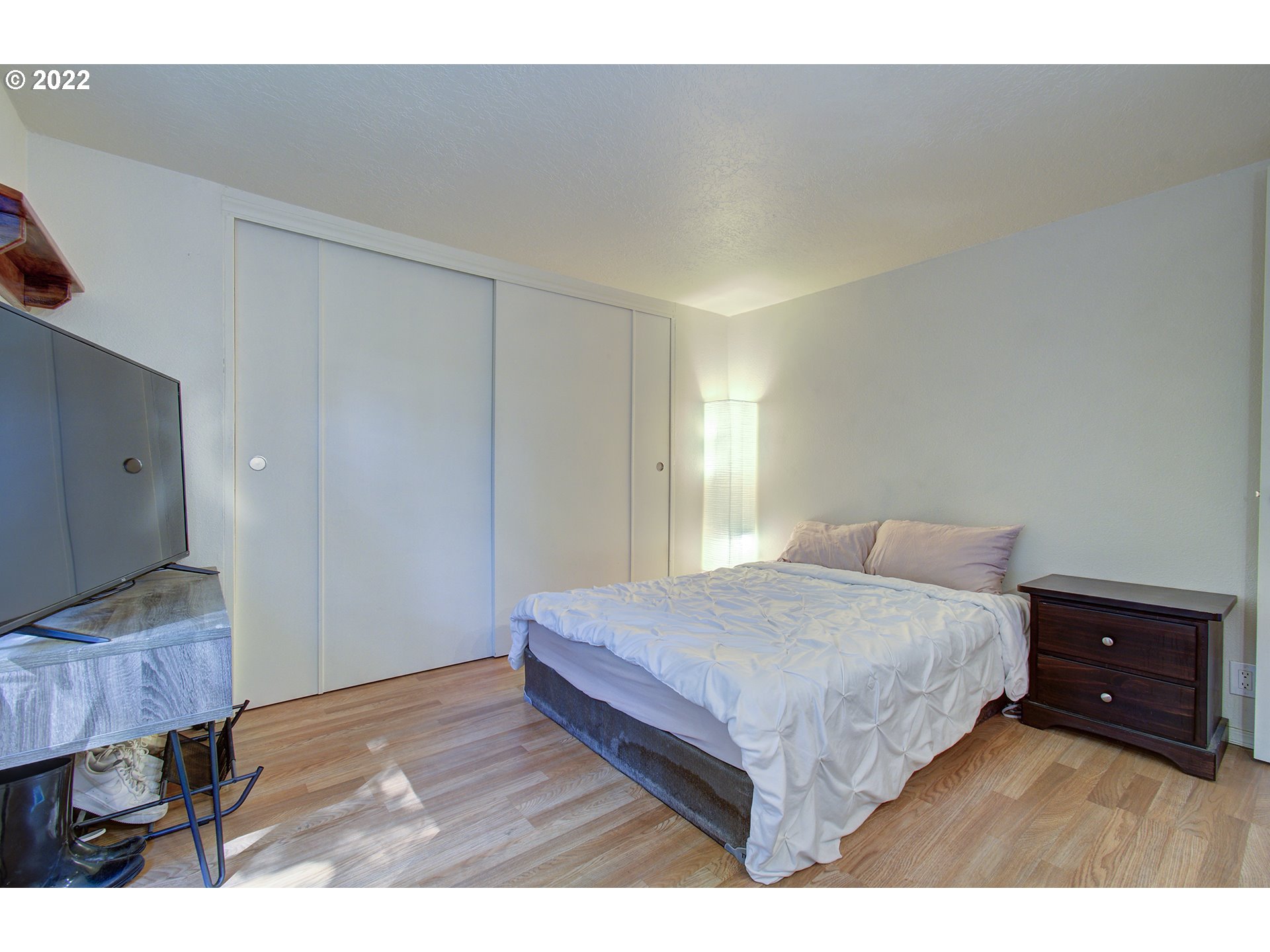 24416 Northeast Berry Road Battle Ground, WA 98604 - Photo 16 of 31 a bedroom with a bed and a dresser in it