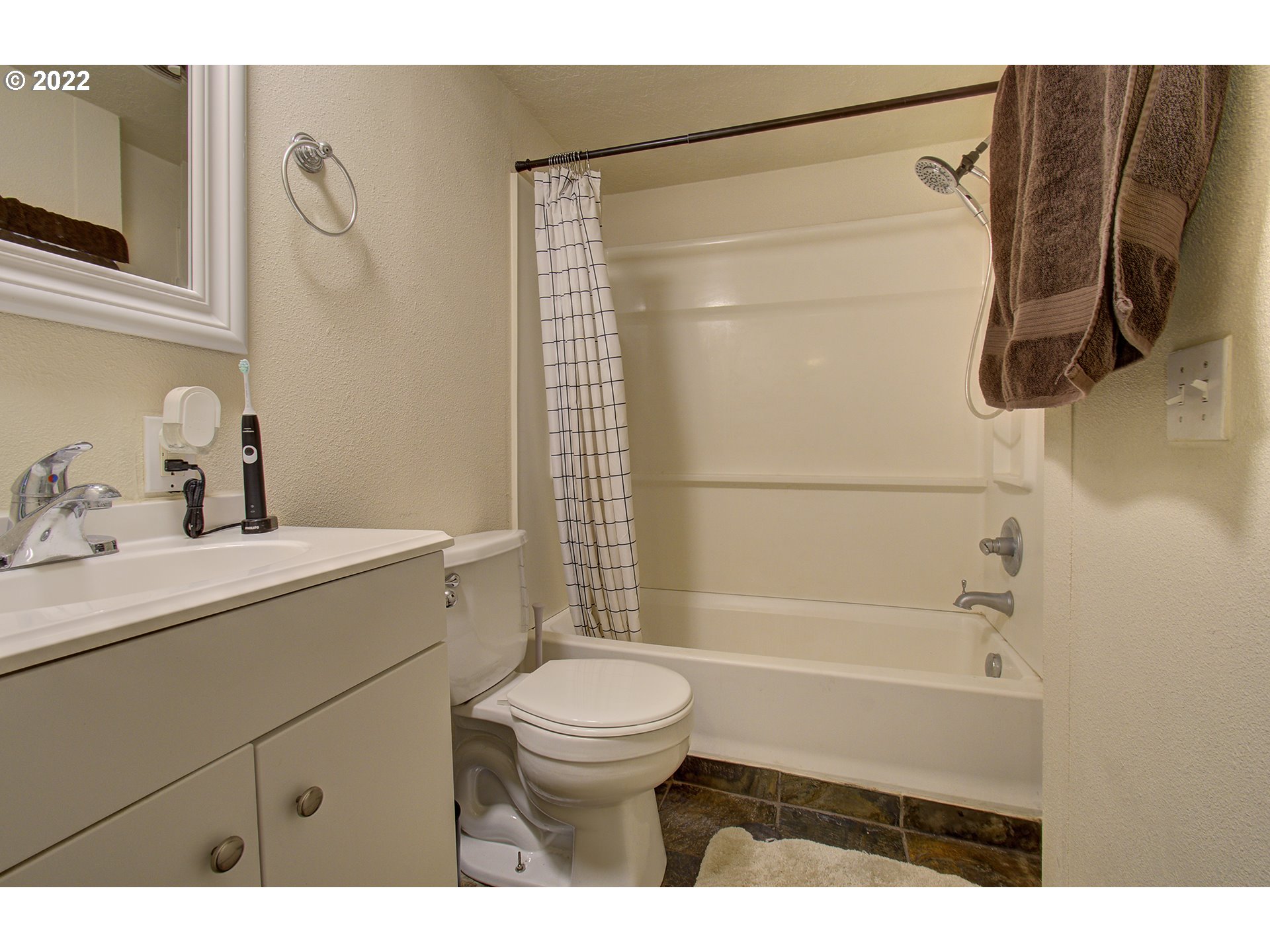 24416 Northeast Berry Road Battle Ground, WA 98604 - Photo 17 of 31 a bathroom with a shower a sink and a toilet