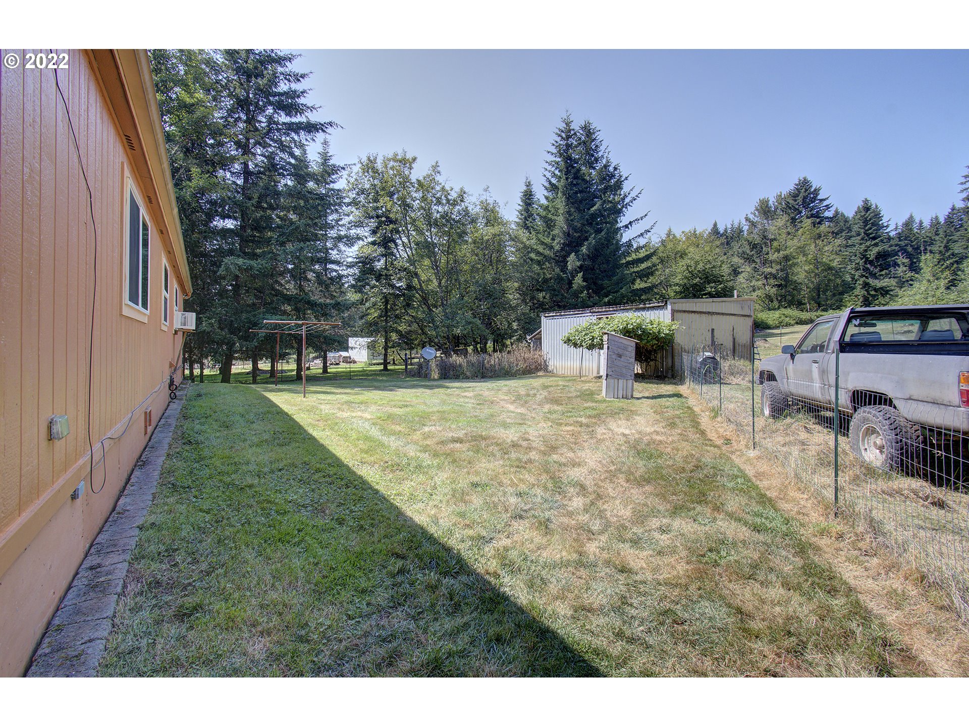 24416 Northeast Berry Road Battle Ground, WA 98604 - Photo 24 of 31 a view of a backyard with sitting area