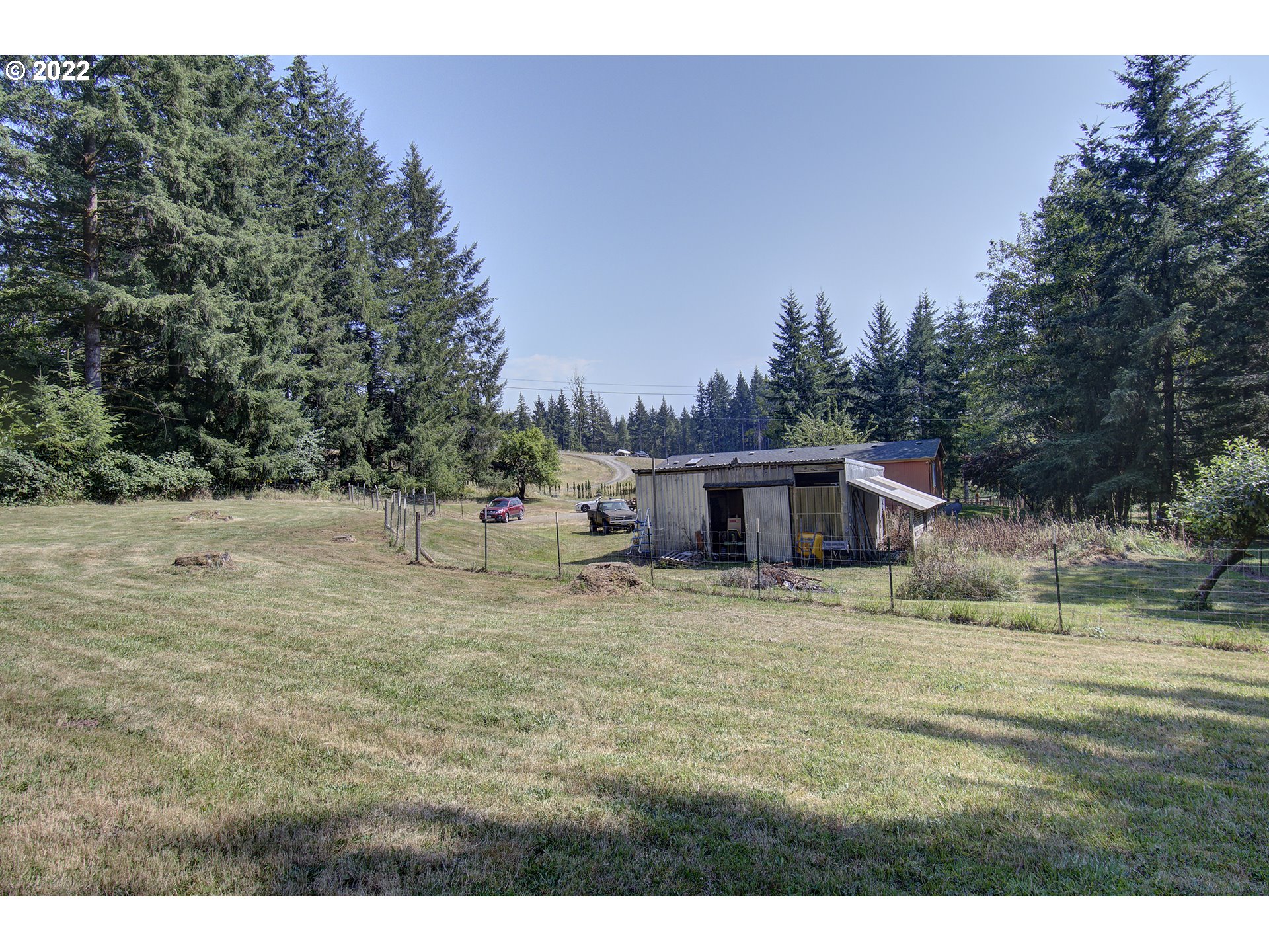 24416 Northeast Berry Road Battle Ground, WA 98604 - Photo 27 of 31 a house with a yard covered in the back
