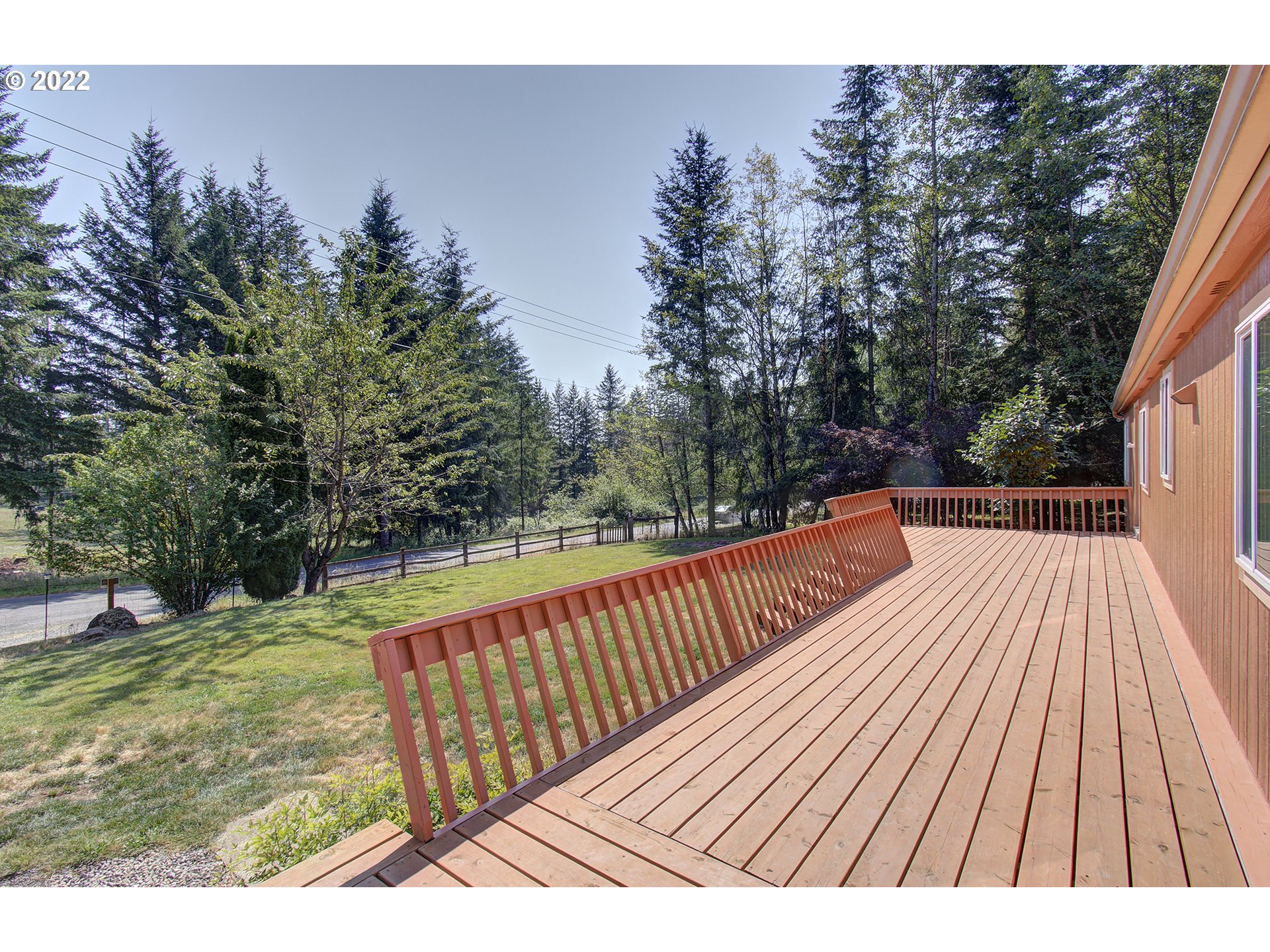 24416 Northeast Berry Road Battle Ground, WA 98604 - Photo 30 of 31 a view of balcony with wooden floor and outdoor space
